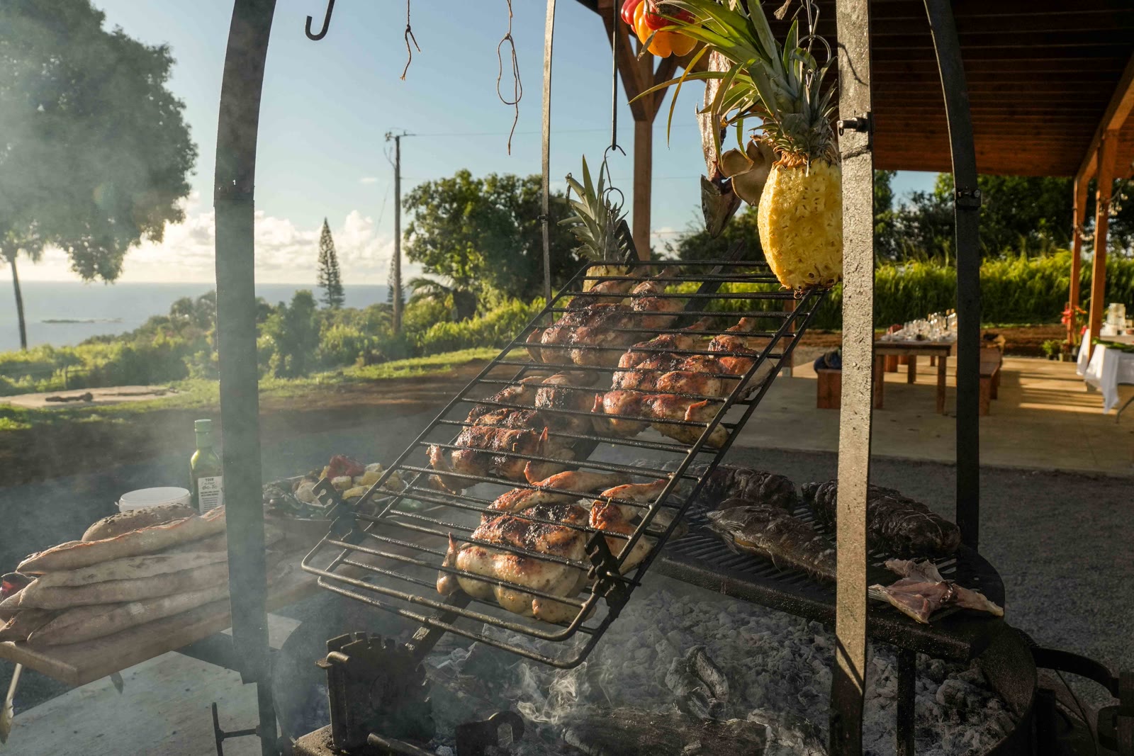 Open-fire grill with pineapples and ocean view